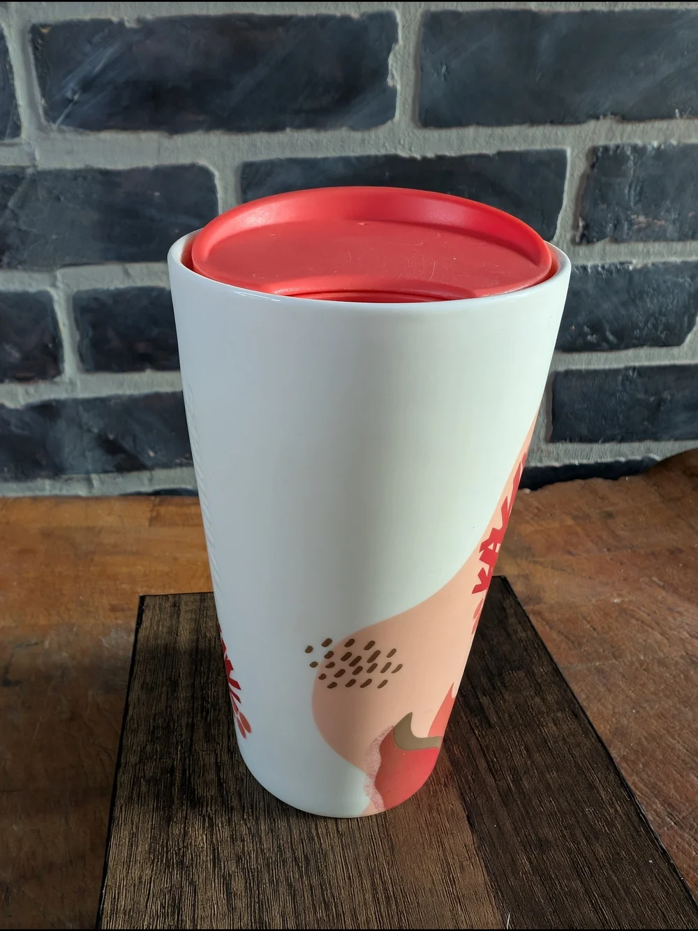 Starbucks White Ceramic Travel Mug with Coral Lid and Pinecone Accent